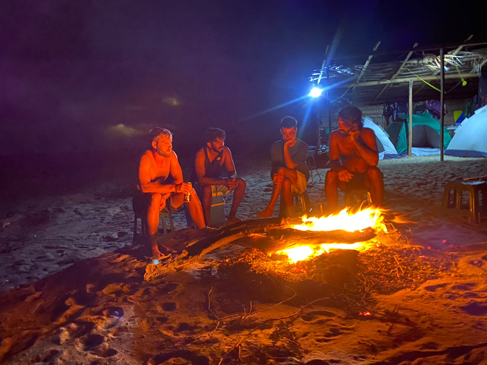 Riders around the bonfire at the beach camp – kitesurfing in Kalpitiya, Sri Lanka (photo 1)